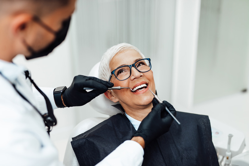 Dr. Tim Silegy reviewing dental imaging with a patient during a consultation.